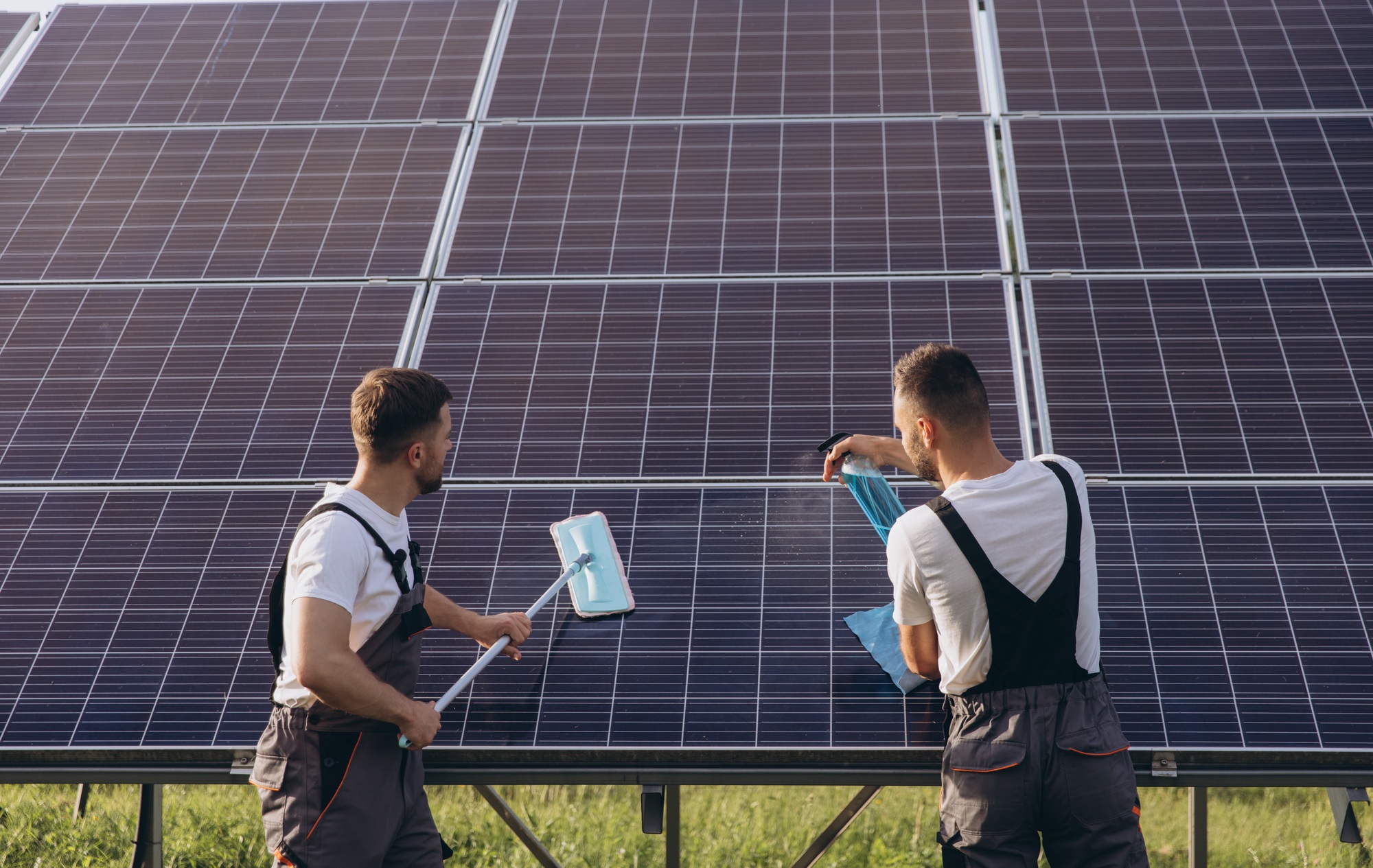 Labor working on cleaning solar panel at solar power plant, Professional cleaning, Solar panels.