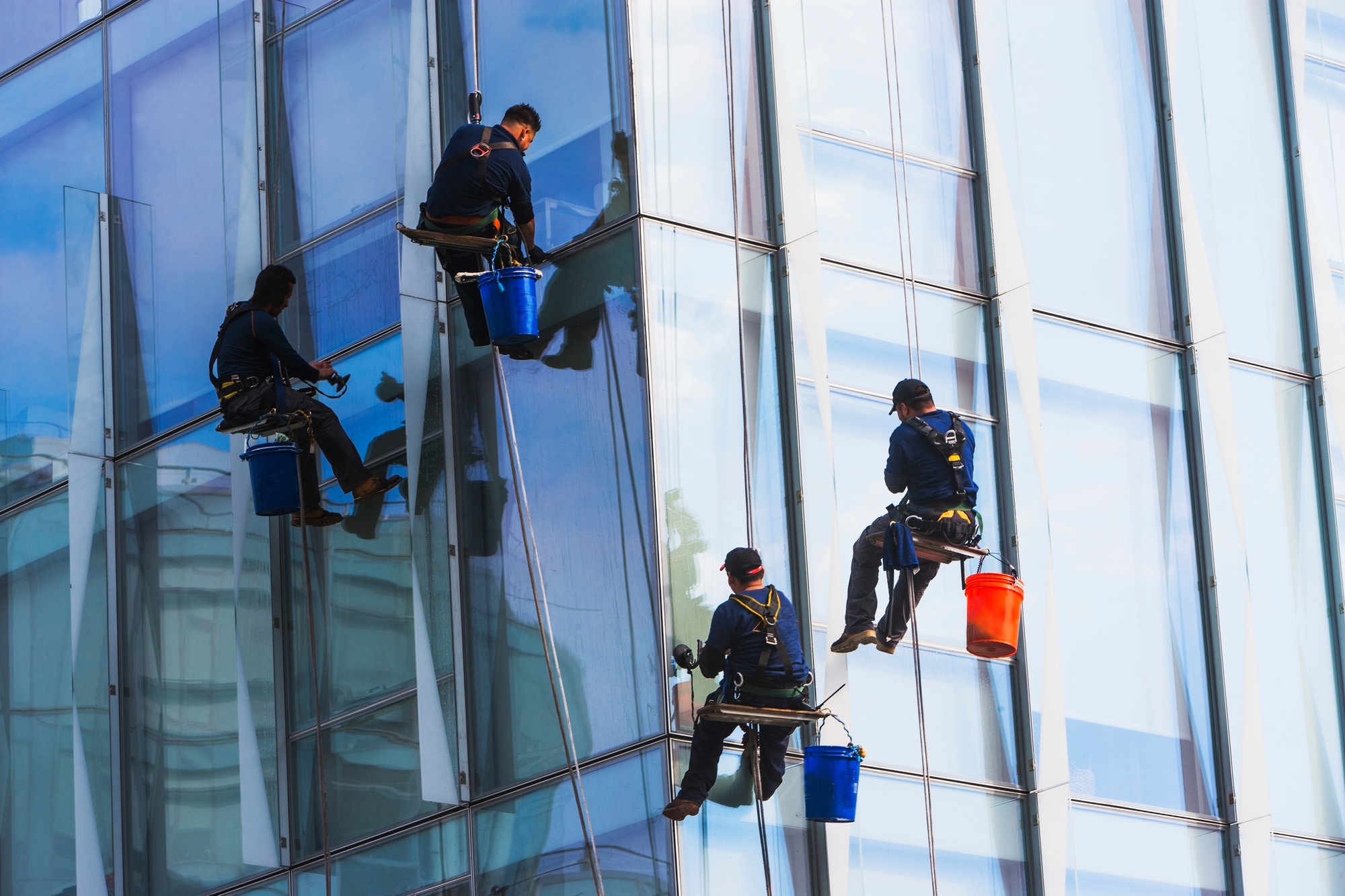 Window cleaners working on a high-rise building